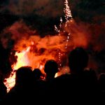 Fireworks display Fireworks display - Silhouettes around the bonfire